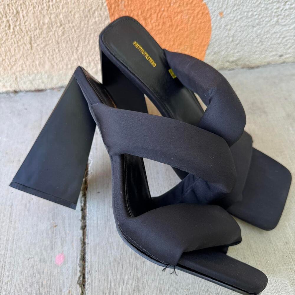Black puffy faux leather triangle